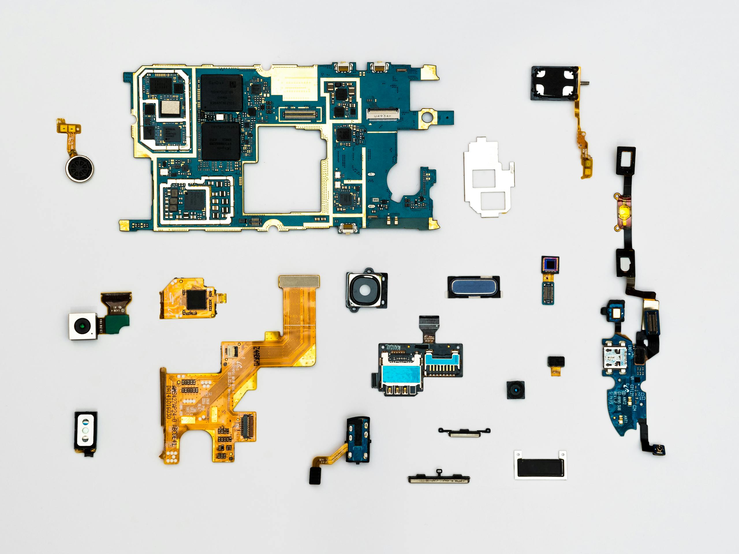 Exploded view of smartphone components showcasing intricate technological design.